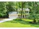 Beautiful two-story home with a well-kept lawn, attached garage, and a welcoming front porch at 7021 Oviedo Dr, Raleigh, NC 27603