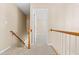 Upstairs hallway featuring carpet floor and view of an open doorway at 7021 Oviedo Dr, Raleigh, NC 27603