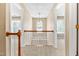 Hallway with carpet floor and view of a pendant light hanging above the stairs at 7021 Oviedo Dr, Raleigh, NC 27603