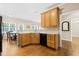 Functional kitchen featuring wooden cabinets, laminate countertops, and an eat-in area at 7021 Oviedo Dr, Raleigh, NC 27603