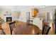 Open floor plan with fireplace, stairs, kitchen, and hardwood floors at 7021 Oviedo Dr, Raleigh, NC 27603