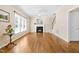 Spacious living room with fireplace, stairs, and hardwood floors at 7021 Oviedo Dr, Raleigh, NC 27603