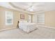 Spacious main bedroom with trey ceiling, carpet and windows allowing natural light at 7021 Oviedo Dr, Raleigh, NC 27603