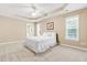 Bright main bedroom with trey ceiling, carpet and windows allowing natural light at 7021 Oviedo Dr, Raleigh, NC 27603