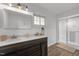 Bathroom with double sink vanity, a glass-enclosed shower, and a neutral color scheme at 7042 Us 401 Highway N, Fuquay Varina, NC 27526
