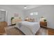 Bright bedroom featuring a queen-size bed, stylish decor, and warm, inviting ambiance at 7042 Us 401 Highway N, Fuquay Varina, NC 27526