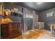 Dark gray Bedroom featuring a changing table, a white crib, hardwood floors, and a decorative cowhide rug at 7042 Us 401 Highway N, Fuquay Varina, NC 27526