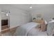 Bedroom with hardwood floors, ceiling fan, closet, and connection to the en-suite bathroom at 7042 Us 401 Highway N, Fuquay Varina, NC 27526
