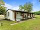 Well maintained brick ranch with professionally landscaped yard, rocking chair porch and attached garage at 7042 Us 401 Highway N, Fuquay Varina, NC 27526