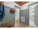 Hallway featuring wainscoting, hardwood ceiling, and open doorways leading to other rooms at 7042 Us 401 Highway N, Fuquay Varina, NC 27526