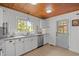 Bright kitchen features granite counters, white cabinets, and stainless steel appliances at 7042 Us 401 Highway N, Fuquay Varina, NC 27526
