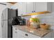 Kitchen details include granite countertops, under cabinet lighting, and stainless steel appliances at 7042 Us 401 Highway N, Fuquay Varina, NC 27526