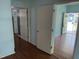 Hallway with wood floors offering views into other rooms at 709 Gerard St, Durham, NC 27701