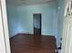 This living room has light blue walls and wood flooring at 709 Gerard St, Durham, NC 27701