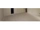 Spacious basement with a door for storage, awaiting customization at 7102 Hubner Pl # 46, Cary, NC 27519