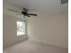 A cozy bedroom featuring a ceiling fan and a well-lit space from the window at 7102 Hubner Pl # 46, Cary, NC 27519