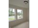 Bedroom with two windows that provide natural light and views of the outdoors at 7102 Hubner Pl # 46, Cary, NC 27519