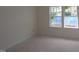A cozy bedroom featuring large windows and a well-lit space at 7102 Hubner Pl # 46, Cary, NC 27519