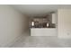 Bright, spacious kitchen with white cabinets, an island, and modern design features at 7102 Hubner Pl # 46, Cary, NC 27519