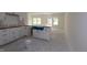 Bright, spacious kitchen with white cabinets, an island, and modern design features at 7102 Hubner Pl # 46, Cary, NC 27519