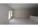 Spacious, light-filled living room with a French door leading to the backyard at 7102 Hubner Pl # 46, Cary, NC 27519
