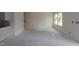 Spacious living room area with a stairway and view from the windows at 7102 Hubner Pl # 46, Cary, NC 27519