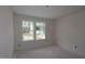 Bright bedroom with double window, fresh paint, and ample natural light at 7104 Hubner Pl # 45, Cary, NC 27519