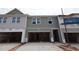 New townhome construction featuring an attached garage and horizontal siding at 7104 Hubner Pl # 45, Cary, NC 27519