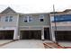 New townhome construction featuring an attached garage and horizontal siding at 7104 Hubner Pl # 45, Cary, NC 27519