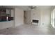 Open-concept living room features steps to the upper level, access to the kitchen, and fireplace at 7104 Hubner Pl # 45, Cary, NC 27519