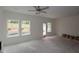 Living room with a ceiling fan, recessed lighting, and access to the outdoors at 7104 Hubner Pl # 45, Cary, NC 27519