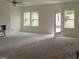 Spacious living room with a ceiling fan, recessed lighting, and access to the outdoors at 7104 Hubner Pl # 45, Cary, NC 27519