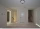 Unfinished space with an overhead light and open access to other areas at 7104 Hubner Pl # 45, Cary, NC 27519