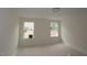 Bedroom featuring neutral walls, recessed lighting, and two windows for natural light at 7106 Hubner Pl # 44, Cary, NC 27519