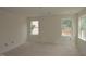 Bedroom with neutral walls and two large windows offering natural light and outdoor views at 7106 Hubner Pl # 44, Cary, NC 27519
