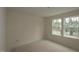 Bedroom featuring neutral walls, recessed lighting, and two windows for natural light at 7106 Hubner Pl # 44, Cary, NC 27519