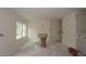 Living room with neutral walls, modern fireplace, and stairs leading to upper level at 7106 Hubner Pl # 44, Cary, NC 27519