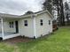 This is a single story home that features clean siding, mulch beds, and a covered front porch at 726 Thompson St, Pittsboro, NC 27312