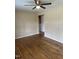 The living room has hardwood floors, neutral paint, a ceiling fan and convenient electrical outlets at 726 Thompson St, Pittsboro, NC 27312