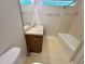 Bright bathroom featuring a vanity, toilet, and a tub/shower combo at 8116 Reynard Rd, Chapel Hill, NC 27516