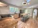 Open kitchen with stainless steel appliances, butcher block island, and vaulted ceiling with skylight at 8116 Reynard Rd, Chapel Hill, NC 27516
