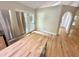 Bright kitchen features stainless steel refrigerator, butcher block island and door leading to outdoor deck at 8116 Reynard Rd, Chapel Hill, NC 27516