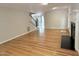 Living room has fireplace, hardwood floors, and view to entry staircase at 8116 Reynard Rd, Chapel Hill, NC 27516