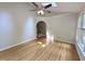 Spacious living room has hardwood floors, recessed lighting, and archway to the staircase at 8116 Reynard Rd, Chapel Hill, NC 27516