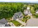Stunning aerial view of a beautiful home with manicured lawn and lush green surroundings at 821 Rambling Oaks Ln, Holly Springs, NC 27540