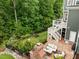 Private backyard features a putting green, outdoor seating area, and multi-level deck at 821 Rambling Oaks Ln, Holly Springs, NC 27540