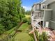 Lush backyard with putting green, professional landscaping, and a spacious outdoor patio at 821 Rambling Oaks Ln, Holly Springs, NC 27540