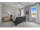 Comfortable bedroom with ample natural light and views of the neighborhood at 821 Rambling Oaks Ln, Holly Springs, NC 27540