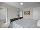 Bedroom featuring an open doorway to an ensuite bathroom at 821 Rambling Oaks Ln, Holly Springs, NC 27540