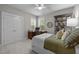 Bedroom with built-in desk and shelving with a comfortable bed at 821 Rambling Oaks Ln, Holly Springs, NC 27540
